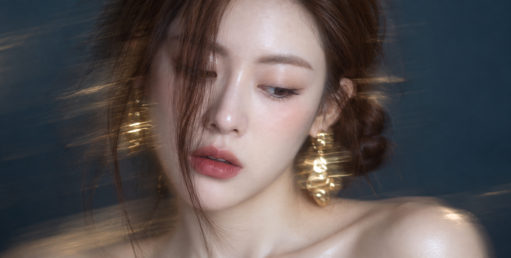 Motion Blur and Extreme Close-Up Portrait of a Woman Looking Down
